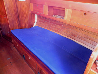 The starboard settee backrest is lowered to make another berth which is around 3ft wide. Both berths have sturdy lee cloths.